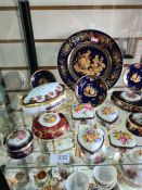 A shelf of decorative limoges trinket boxes and similar and one other shelf of China and crystal