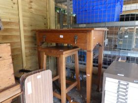 An arts and Crafts style oak side table having one drawer, 30cm x 30cm