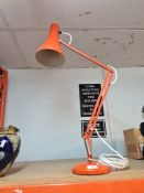 A Herbert Terry vintage Anglepoise lamp stamped 90, of orange colour