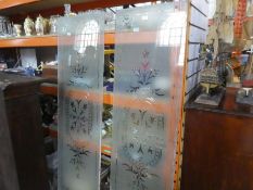 A pair of early 20th Century etched glass panels, having floral central motifs, approx 160 x 47.5 cm