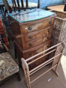A reproduction pillar chest having 7 drawers, a wicker drinks rack and a towel airer