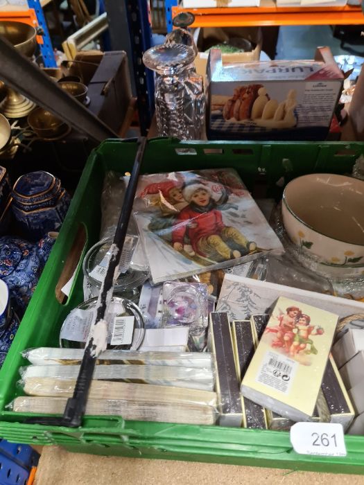 A crate of mixed new goods including napkins, bowls, glassware, china, etc