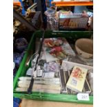 A crate of mixed new goods including napkins, bowls, glassware, china, etc