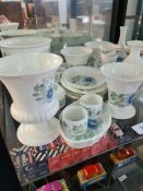 Two shelves of decorative Wedgewood items including clementine and Hathaway rose designs