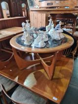 A 1970s G-Plan style circular coffee table having glass top and two other small tables