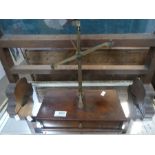 An old set of weighing scales having wooden box base, with one drawer