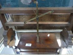 An old set of weighing scales having wooden box base, with one drawer