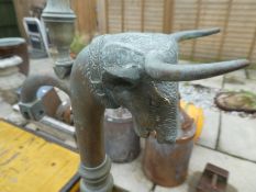 A set of brass weighing scales decorated bulls head