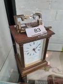 A modern carriage clock by Matthew Norman, Swiss made, with folding handle