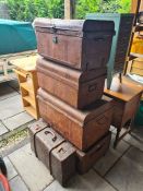 Two old large trunks, two medium sized trunks and a leather style case