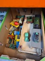 A box of playworn Dinky, Triang, Hornby and other vehicles to include a wooden garage and a Hornby '