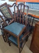 A set of eight 1920s mahogany dining chairs having pierced splats including a pair of carvers (8)