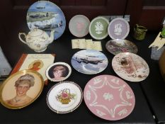 A box of mostly collector's plates of various designs and manufactuers