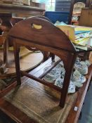A reproduction mahogany butlers tray on matching stand in form of coffee table
