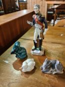 A Dresden figure of military soldier, two Copenhagen figures and a Poole otter