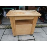 A beech kitchen work station having one draw with cupboard below