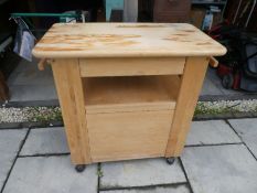 A beech kitchen work station having one draw with cupboard below
