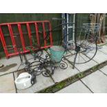 A plant stand in form of a Penny Farthing, two circular wrought iron plant stands and sundry