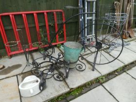 A plant stand in form of a Penny Farthing, two circular wrought iron plant stands and sundry