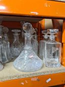 A selection of cut-glass items including ship's decanter, various other decanters, glasses, etc