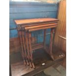 A nest of 4 reproduction mahogany coffee tables