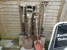 A quantity of old garden spades and similar