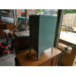 A metal filing cabinet and a small oak wash stand