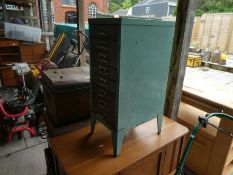 A metal filing cabinet and a small oak wash stand
