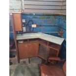 A 1970s teak drinks bar having 45 degree angle with marble style top