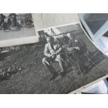 A small quantity of World War II black and white photographs to include Winston Churchill and other