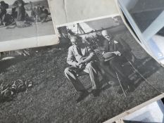 A small quantity of World War II black and white photographs to include Winston Churchill and other