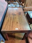 An antique mahogany oblong coffee table with shallow gallery sides