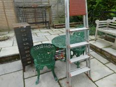 A garden table and two chairs, a metal filing cabinet