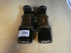 A pair of World War I field binoculars with partial leather covering