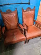 A pair of late Victorian mahogany open armchairs having carved top rail