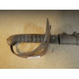 A Cavalry sword with engraved blade and steel scabbard, blade 83cms, scabbard 86 cms