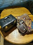 A Vanity case, a Bell and Howell cine camera and a rug