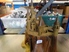 A wooden carved fantasy style castle