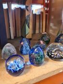 A small quantity of paperweights and a pair of vases, having silver rim