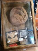 A vintage display containing 1950s leather football and other related items