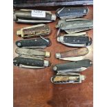 A collection of folding knives, some Military to include some 19th Century examples