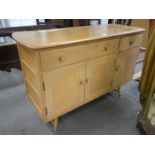 A 1960s Ercol style sideboard having Elm top with drawers and cupboards, 123cm