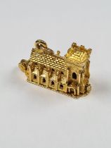 Large 9ct yellow gold charm/pendant in the form of a Church, the base opening to reveal a font, mark