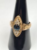 Antique yellow gold dress ring with marquise shaped panel with central sapphire doublet flanked 3 sm