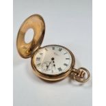 9ct gold cased Half Hunter 'Waltham' pocket watch, with white enamel dial and Roman numerals with su