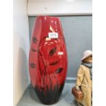 A modern Poole vase decorated butterfly and flowers, the body red glazed 38cm