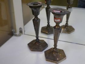 A pair of silver candlesticks on hexagonal bases. Hallmarked Birmingham 1919. 21.5cm tall approx. Ma