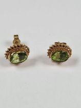 9ct yellow gold stud earrings set with peridots, with twisted frame, marked 375, approx 1.94g