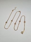 9ct yellow gold box chain with 7 attached balls, marked 375, 47cm, approx 4.74g