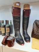 A pair of black leather gents riding boots having red cursor with wooden stretchers, size 10.5 and a